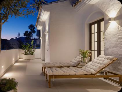 Aldea Blanca 34, whitewashed terrace with sun loungers at dusk