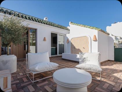 La Colina 11, terracotta-tiled terrace with white outdoor furniture